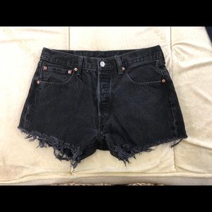 Black cut off jean shorts by Levi Strauss & Co